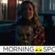 Judy Greer's Karen holds up the mask of Michael Meyers while looking distressed, presumably because she's a character in Halloween Kills.
